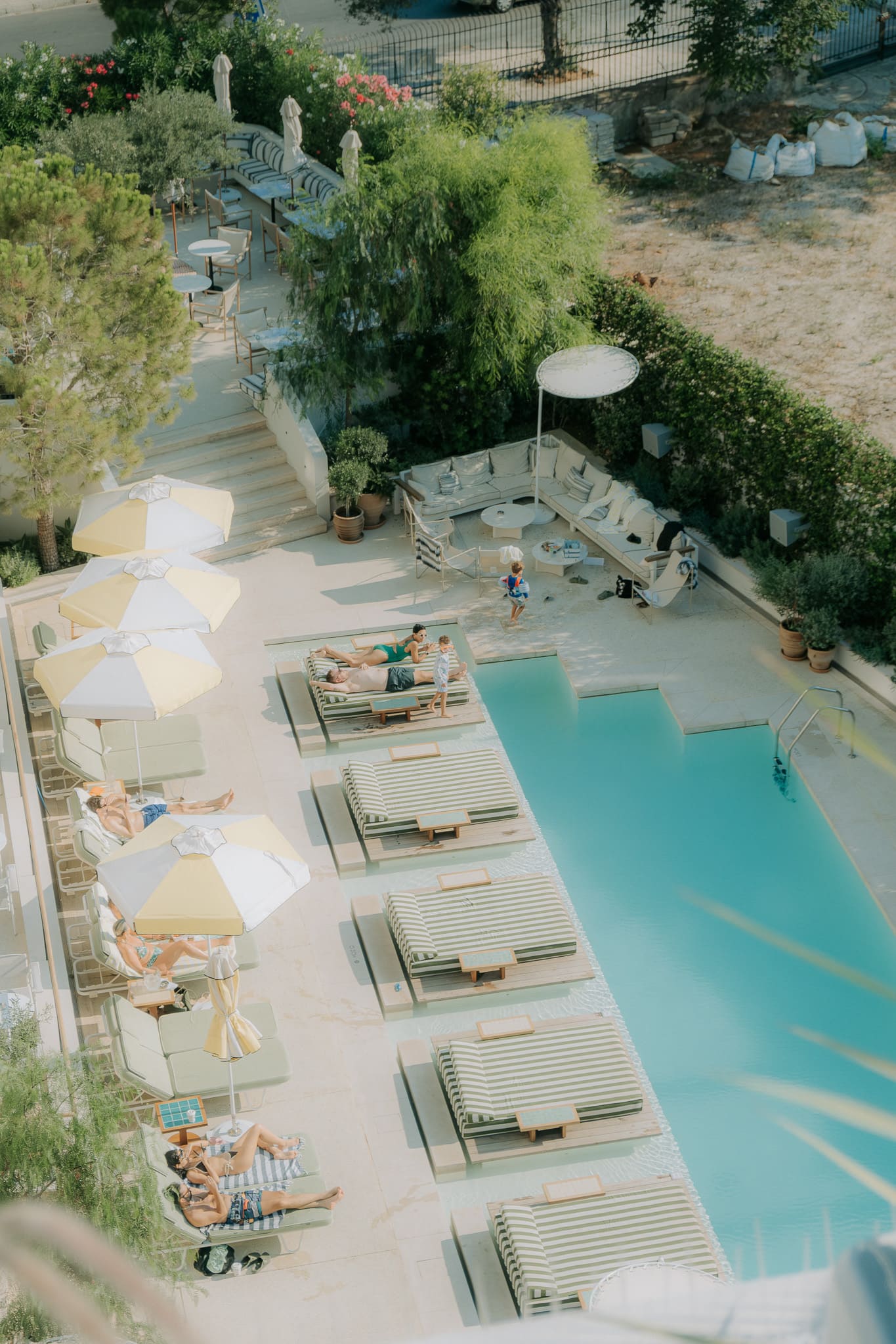ACE Hotel pool, showing clear blue water, lounge chairs, and surrounding poolside area.